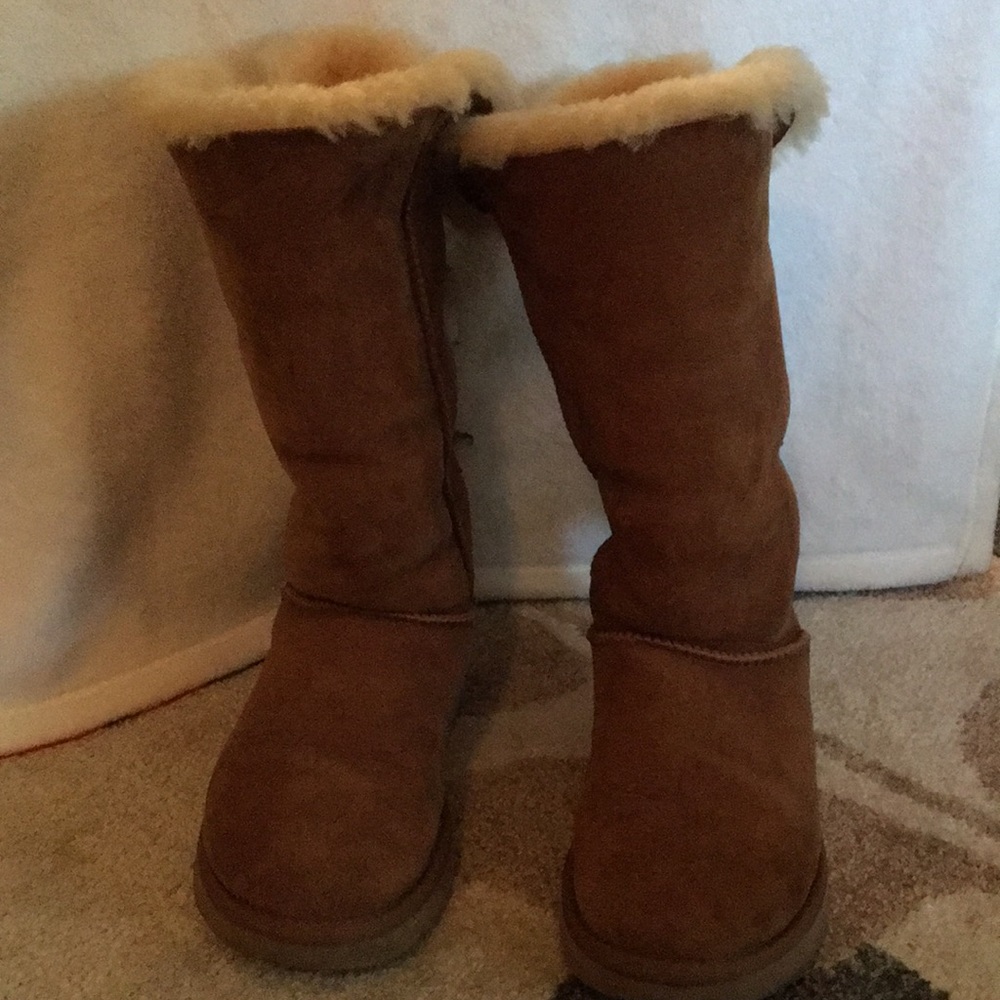 Three bow tall authentic UGG boots.